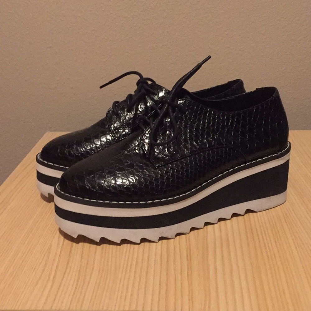 Black snakeskin platform shoes